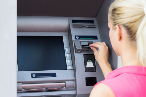 Young woman using credit card