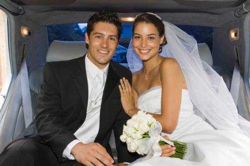 Bride and groom in limousine