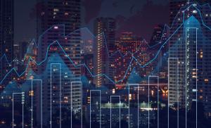 Trading graph on the cityscape at night and world map background,Business financial concept
