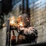 Industrial Worker welding steel