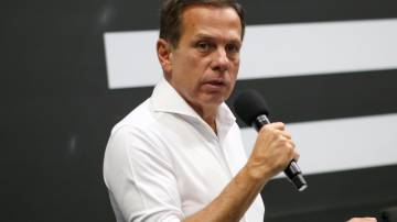 João Doria fala em microfone durante evento do governo de São Paulo