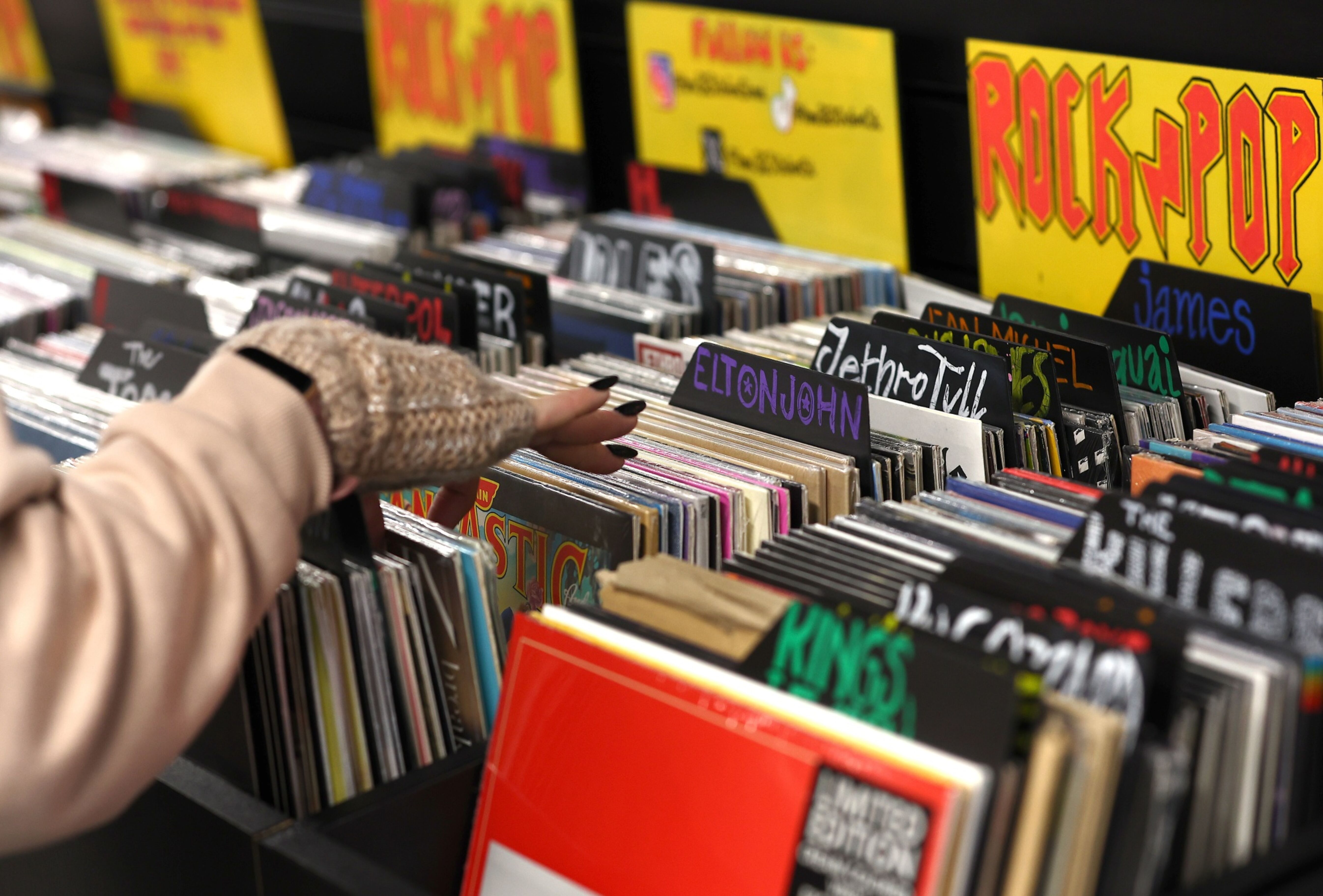 A customer browses records at the HMV store on Oxford Street in London. Photographer: Peter Nicholls/Getty Images