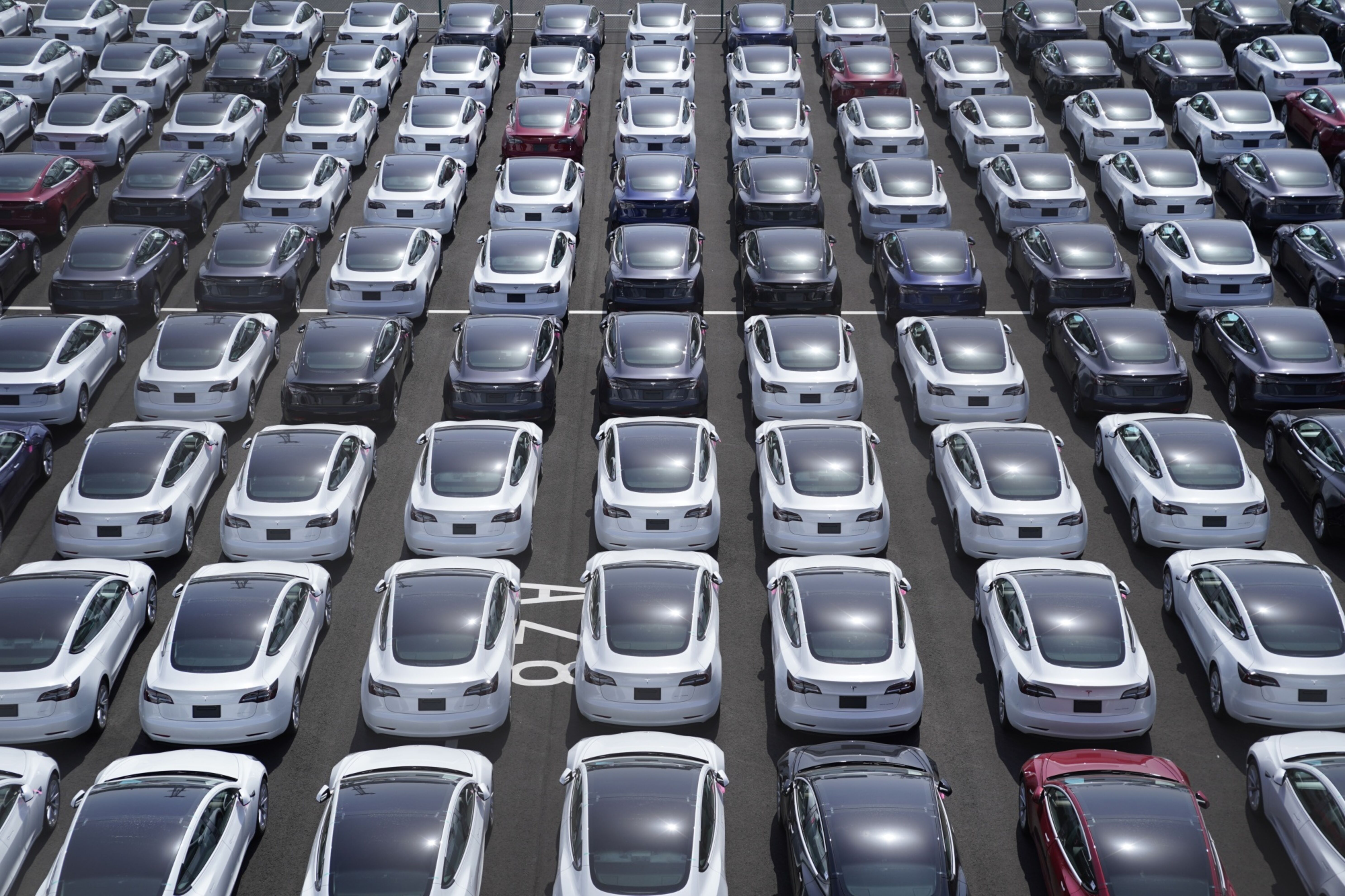 Tesla vehicles in a parking lot after arriving at a port in Yokohama, Japan. Photographer: Toru Hanai/Bloomberg