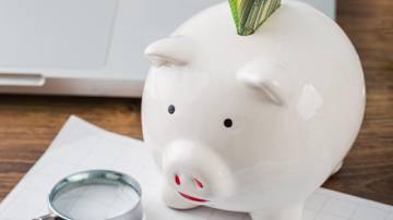 high-angle-office-items-with-piggy-bank-growth-chart