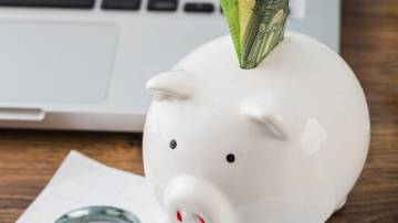 high-angle-office-items-with-piggy-bank-growth-chart