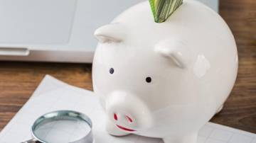 high-angle-office-items-with-piggy-bank-growth-chart