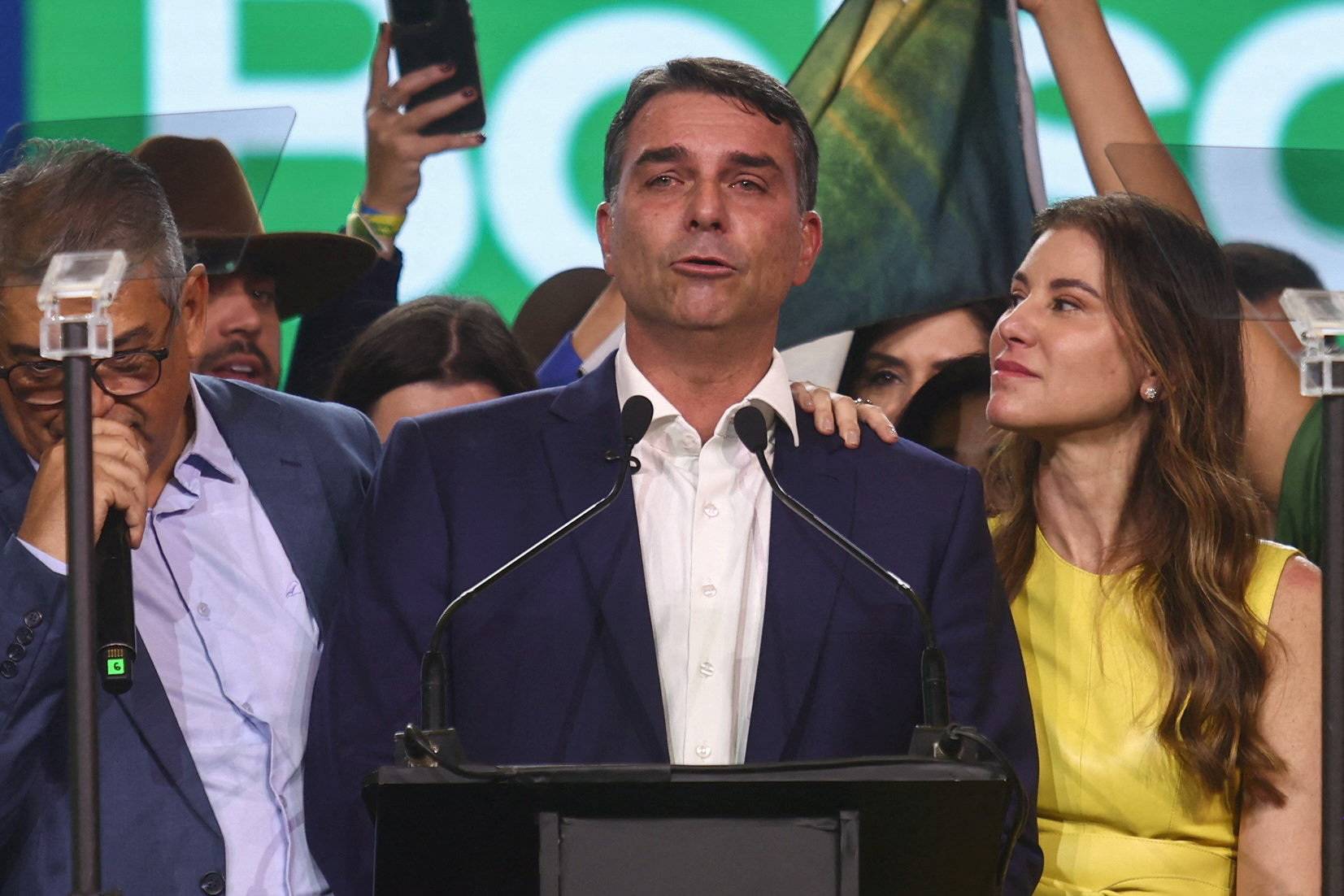 Brazilian Senator Flavio Bolsonaro, who is to be announced as candidate for Brazil's presidential elections, delivers a speech next to his wife, Fernanda Bolsonaro, during the national convention of the Liberal Party (PL) in Sao Paulo, Brazil, July 25, 2026. REUTERS/Jean Carniel
